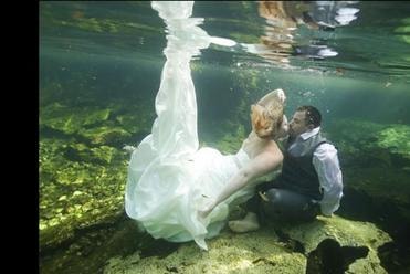 Couple celebrating an underwater destination wedding
